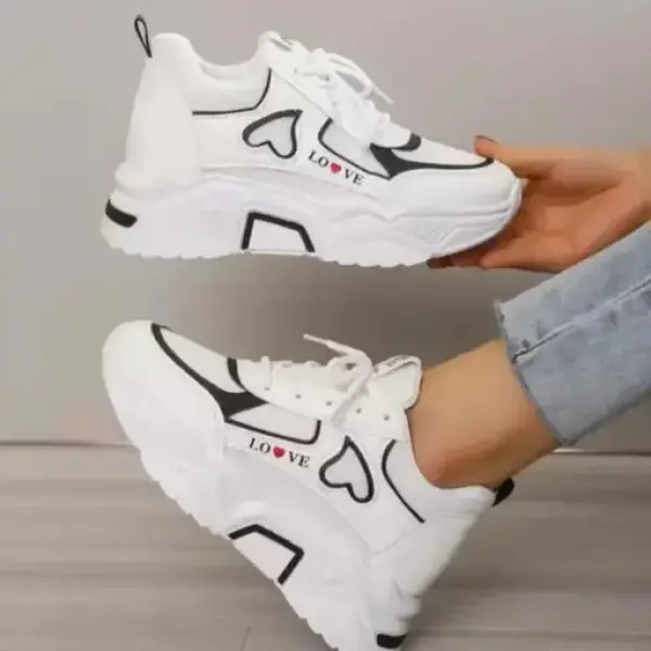Women's white and black Love shoes